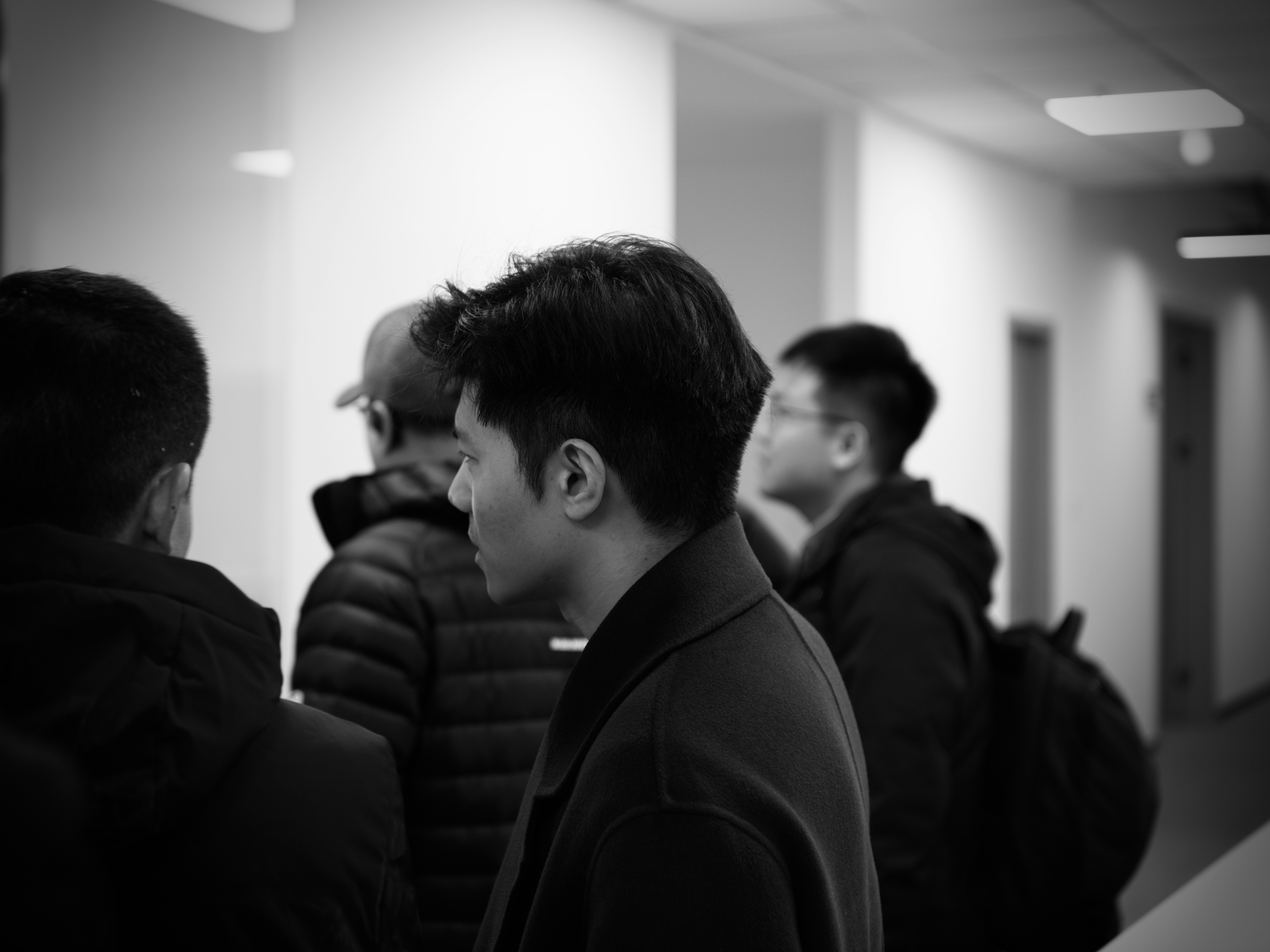 A group of people looking to the left.