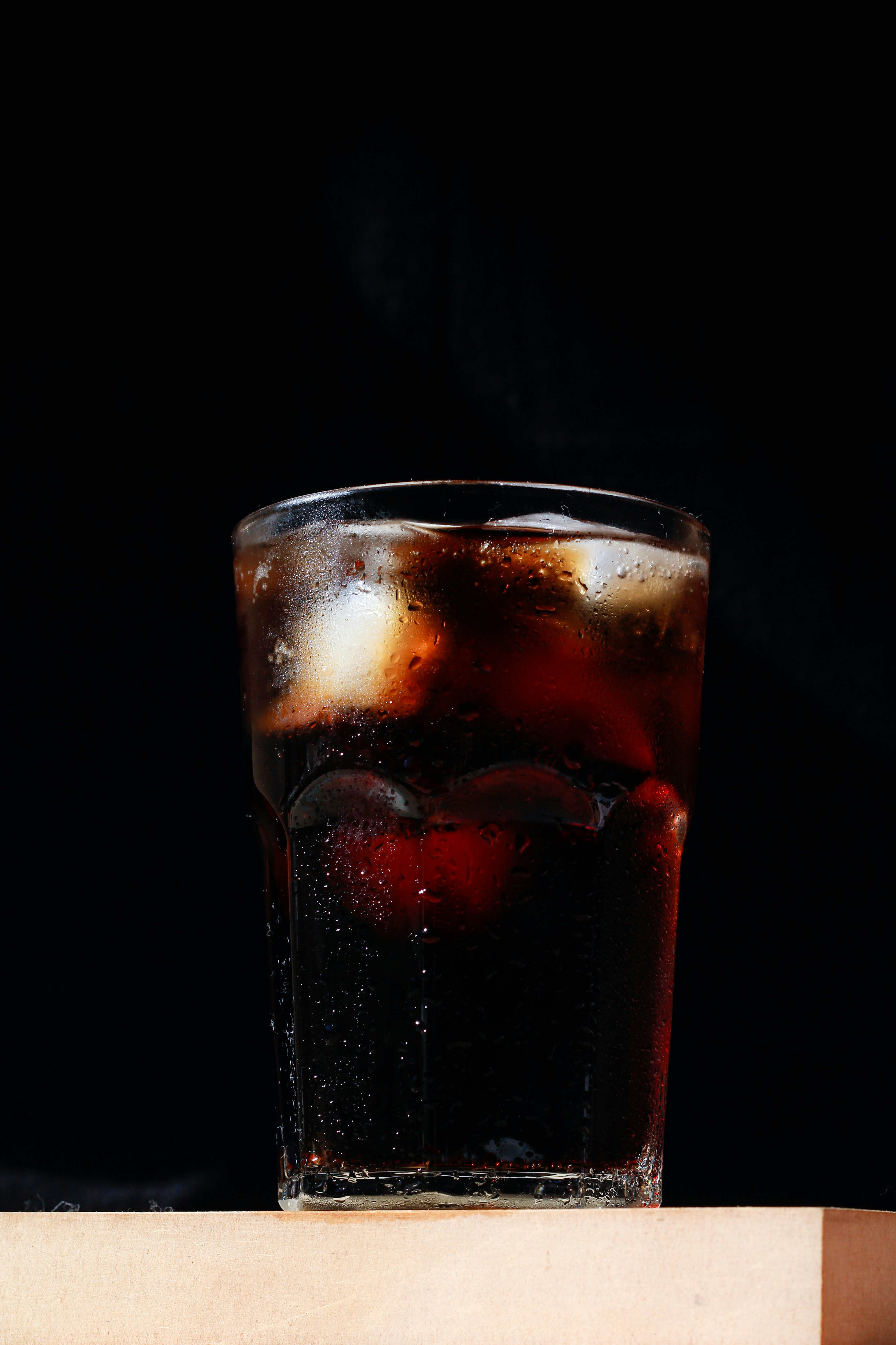 A glass of brown soda.